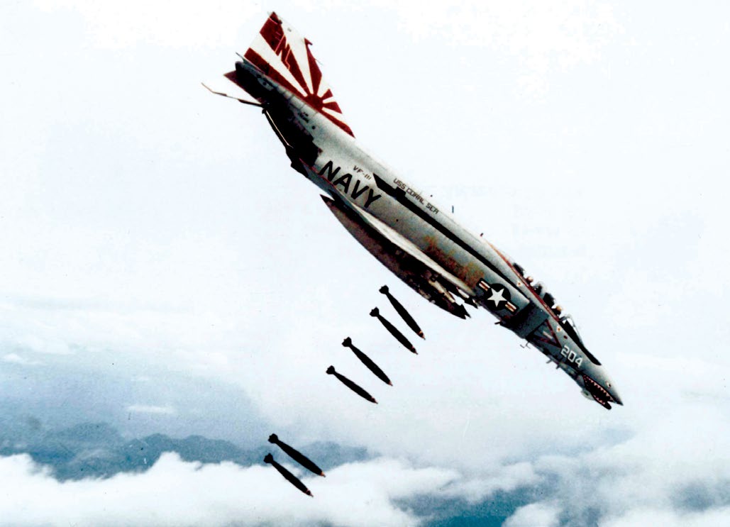 A U.S. Navy McDonnell F-4B Phantom II of Fighter Squadron VF-111 Sundowners drops 227 kg Mk 82 bombs over Vietnam during 1971. VF-111 was assigned to Attack Carrier Air Wing 15 (CVW-15) aboard the aircraft carrier USS Coral Sea for a deployment to Vietnam, November 25, 1971 (Navy photo/public domain).